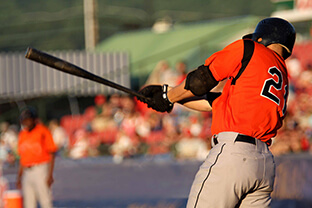 baseball batter swinging at a pitch